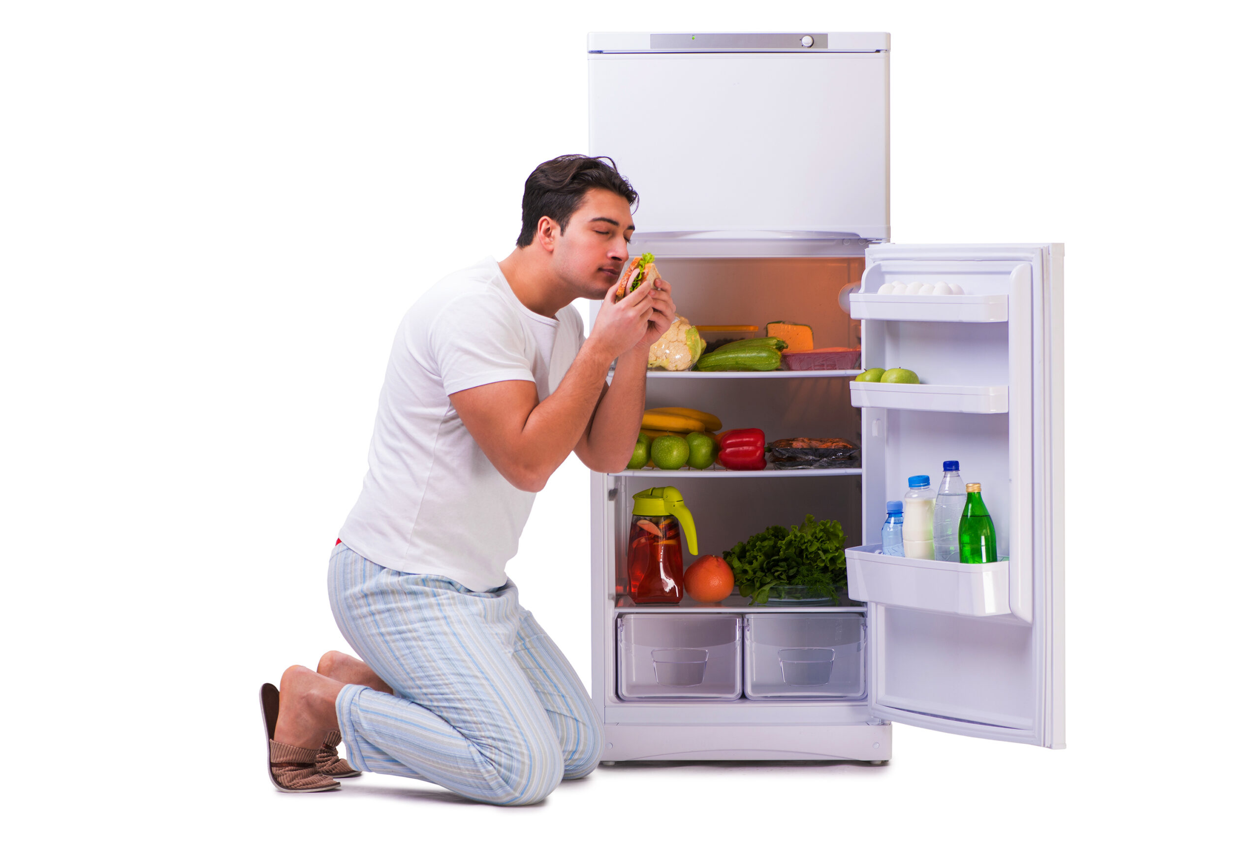 Man next to fridge full of food